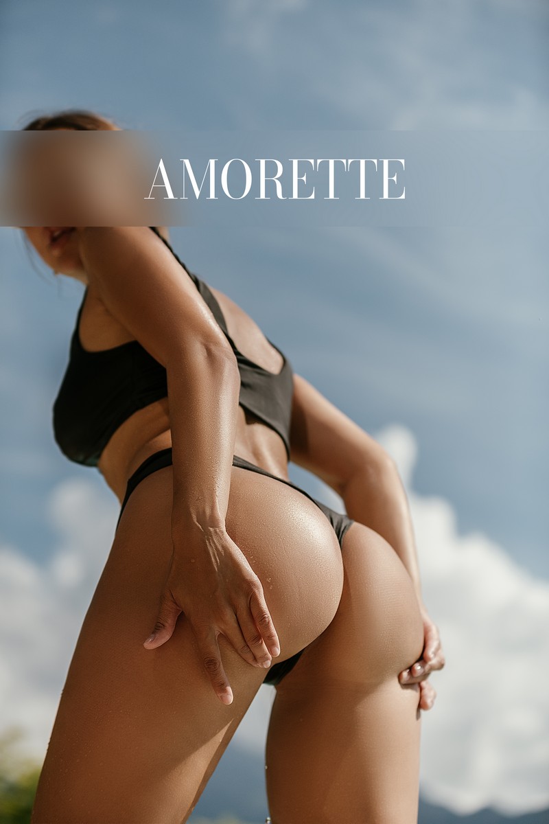 Alina – Elite Escort Model from Frankfurt alina elite escort model from frankfurt shows her round butt from the back while holding it with her hands, she wears a black bikini, sun tanned skin, summer, vacation, high class escort, international, elite escort, escort agency, girl, luxury