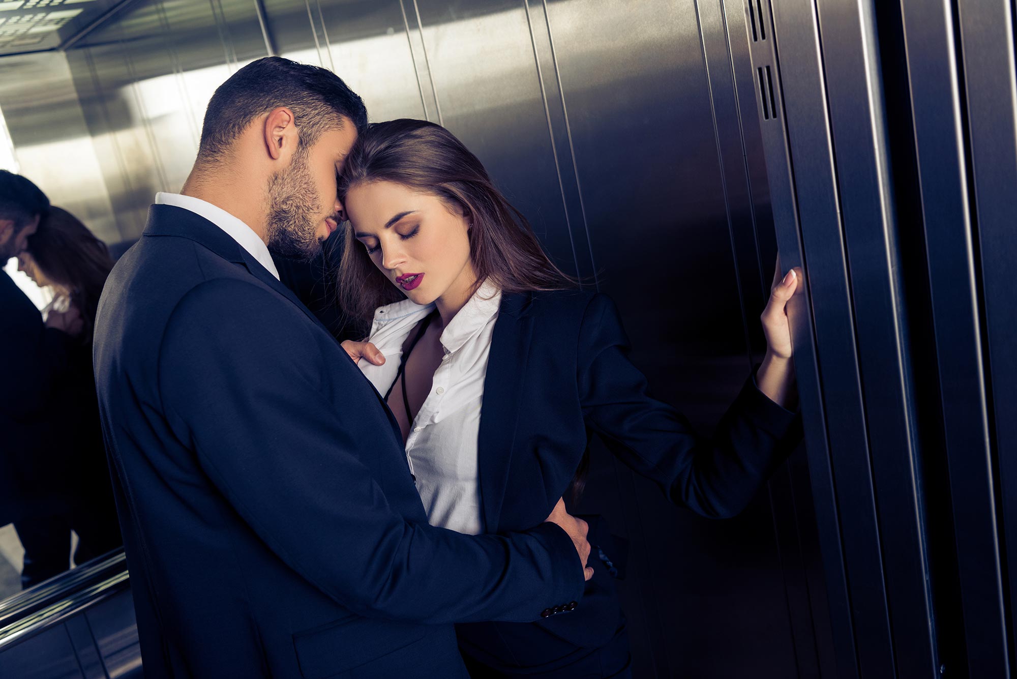 amorette international elite escort agency, high class escort service, business, office, elevator, elegant couple, suuits, white shirts, luxury.