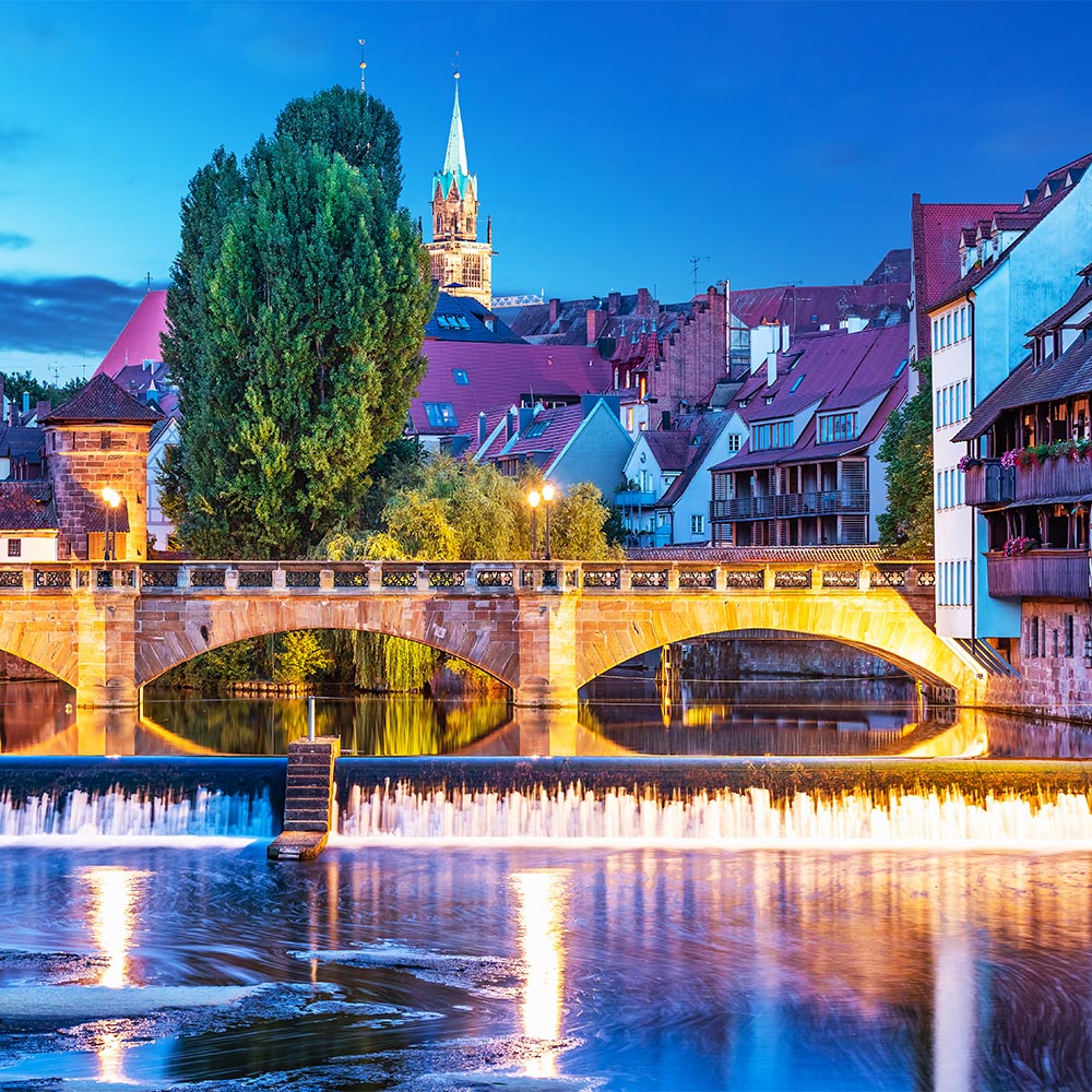 amorette international elite escort agency, high class escort service at nuernberg, germany, nuernberg at evening, byy the river, blue sky, green tree, bridge, stone bridge, old town, luxury, traveling, vacation.